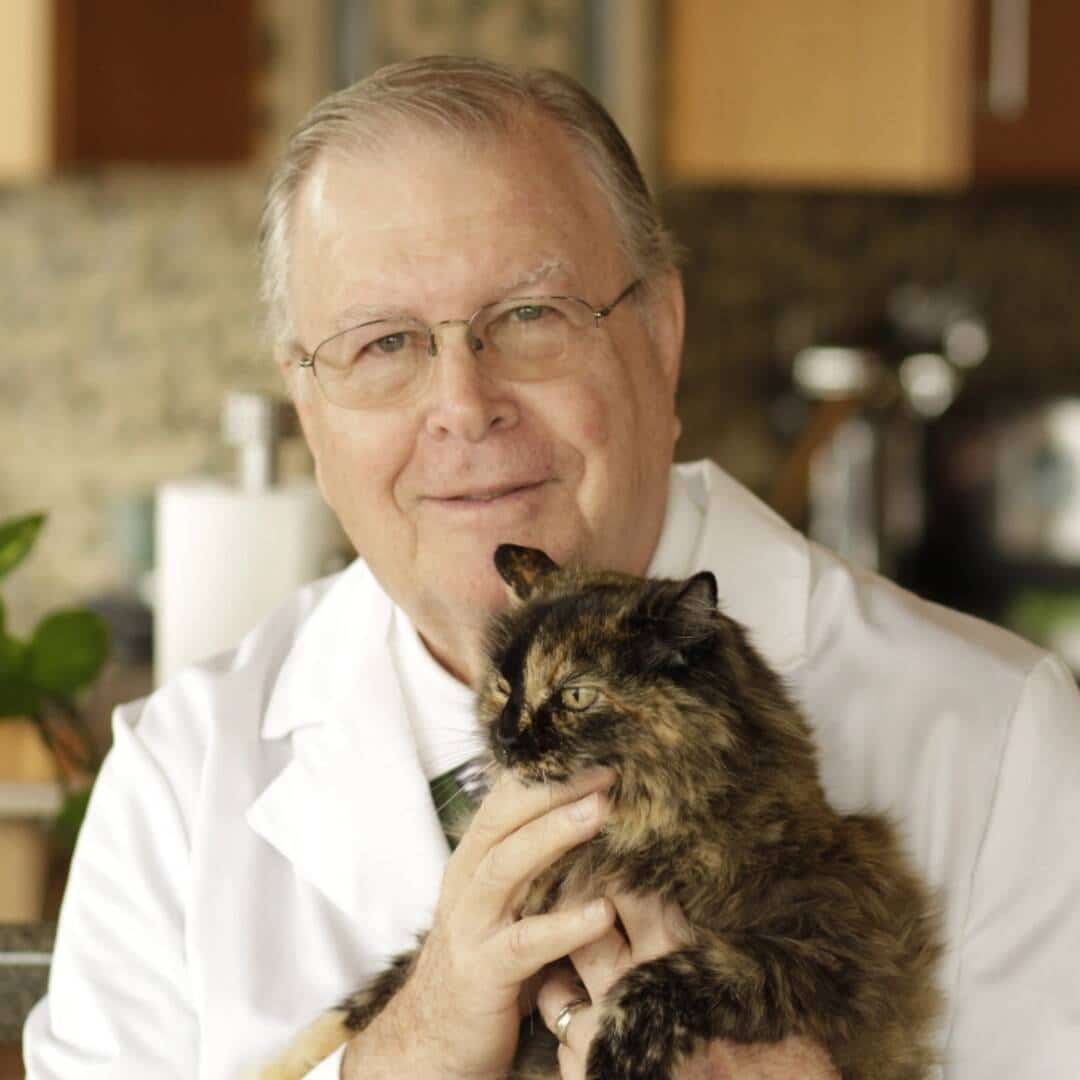 Dr. Bill examining dog